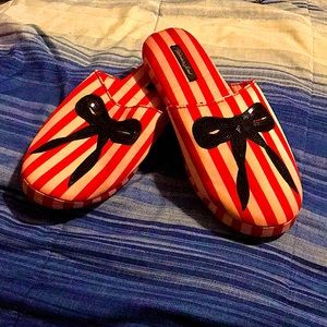 VS slippers, red and pink stripped with a design of a black bow. New with tags.